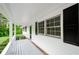 Inviting outdoor porch with white railings and black shutters, perfect for relaxing at 2923 Bicentennial Dr, Stone Mountain, GA 30087