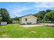 View of backyard with a lush green lawn, privacy fence and an outdoor seating area at 4020 Ester Sw Dr, Atlanta, GA 30331