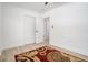 Bright bedroom featuring light-colored hardwood floors, a ceiling fan, and a closet for ample storage at 4020 Ester Sw Dr, Atlanta, GA 30331