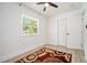 Bedroom with an area rug, ceiling fan, and natural light from the window at 4020 Ester Sw Dr, Atlanta, GA 30331