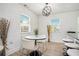 Eat-in dining area features modern light fixture, windows, and seating for four at 4020 Ester Sw Dr, Atlanta, GA 30331