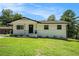 Charming single-story home featuring a well-manicured lawn and lovely front porch at 4020 Ester Sw Dr, Atlanta, GA 30331