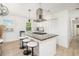 Bright kitchen island features bar stool seating, modern fixtures, and ample counter space at 4020 Ester Sw Dr, Atlanta, GA 30331