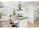 Kitchen with barstool seating, range-style stovetop, and stainless vent system at 4020 Ester Sw Dr, Atlanta, GA 30331