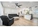Spacious open-concept living area with modern light fixture and comfortable furniture at 4020 Ester Sw Dr, Atlanta, GA 30331