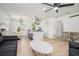 Open living space with a kitchen island, dining area, modern light fixtures and hardwood floors at 4020 Ester Sw Dr, Atlanta, GA 30331