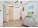 Office space with a stylish sliding barn door, wood floors, and a view from a bright window at 4020 Ester Sw Dr, Atlanta, GA 30331