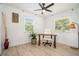 Bright office space with light wood floors, a ceiling fan, and natural light from two windows at 4020 Ester Sw Dr, Atlanta, GA 30331