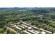 Overhead view of apartments amidst greenery, featuring modern structures, lush trees, and a serene, park-like setting at 6980 Roswell Rd # P6, Atlanta, GA 30328