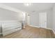Spacious room with wood flooring, neutral walls, ample natural light, and closet space at 6980 Roswell Rd # P6, Atlanta, GA 30328