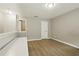 Spacious room with wood flooring, neutral walls, ample natural light, and closet space at 6980 Roswell Rd # P6, Atlanta, GA 30328