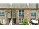 Overhead view of brick townhouses showing rooflines, patios, and covered entries at 6980 Roswell Rd # P6, Atlanta, GA 30328