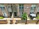 Aerial view of brick townhouses featuring fenced-in patios and covered front entrances at 6980 Roswell Rd # P6, Atlanta, GA 30328