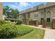 Charming townhome with brick exterior, lush landscaping, gated courtyards, and mature trees at 6980 Roswell Rd # P6, Atlanta, GA 30328