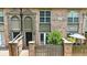 Charming brick townhouse with a small fenced-in patio and covered front entryways at 6980 Roswell Rd # P6, Atlanta, GA 30328