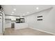 Bright, open kitchen with white cabinets, stainless steel appliances, and sleek countertops at 6980 Roswell Rd # P6, Atlanta, GA 30328