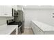 Updated kitchen with stainless steel appliances, white cabinetry, and marble countertops at 6980 Roswell Rd # P6, Atlanta, GA 30328