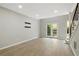 Inviting living room with wood floors and access to the outdoor patio via French doors at 6980 Roswell Rd # P6, Atlanta, GA 30328