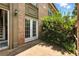 Rear patio displaying bright lighting and lush plants in a shaded outdoor area at 6980 Roswell Rd # P6, Atlanta, GA 30328