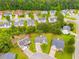 This aerial view shows homes surrounded by lush lawns, mature trees, and quiet streets at 102 Natalie Ct, Dallas, GA 30157