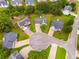 An aerial view showcases the manicured lawns and mature trees surrounding these well-maintained homes at 102 Natalie Ct, Dallas, GA 30157