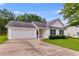 Inviting home with attached garage, neat landscaping, and classic white siding at 102 Natalie Ct, Dallas, GA 30157