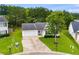 Well-maintained home with attached garage, tidy lawn, and mature trees at 102 Natalie Ct, Dallas, GA 30157