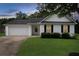 Charming single-story home featuring a well-manicured lawn, attached garage, and inviting front entrance at 102 Natalie Ct, Dallas, GA 30157