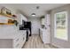 Stylish kitchen with white cabinets, gold hardware, and modern appliances at 102 Natalie Ct, Dallas, GA 30157