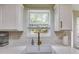 Bright kitchen with ample counter space, undermount sink, and subway tile backsplash at 102 Natalie Ct, Dallas, GA 30157