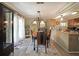 Charming dining area, featuring a view of the kitchen and outdoor access at 1313 Old Countryside Cir, Stone Mountain, GA 30083