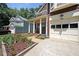 Attractive home with a well-manicured garden, inviting front porch, and convenient attached garage at 1313 Old Countryside Cir, Stone Mountain, GA 30083