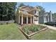 Inviting two-story home with a front garden, a well-kept lawn, and a cozy front porch at 1313 Old Countryside Cir, Stone Mountain, GA 30083