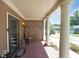 Inviting front porch with rocking chairs, decorative wreaths, and classic white columns at 1313 Old Countryside Cir, Stone Mountain, GA 30083