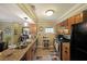 Open kitchen with stainless steel appliances, granite countertops, and wood cabinets at 1313 Old Countryside Cir, Stone Mountain, GA 30083
