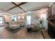 Inviting living room with a stone fireplace, coffered ceilings, and lots of natural light at 1313 Old Countryside Cir, Stone Mountain, GA 30083