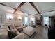 Cozy living room with coffered ceilings, brick fireplace, and plenty of natural light at 1313 Old Countryside Cir, Stone Mountain, GA 30083