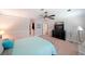 Spacious main bedroom with ceiling fan, television, and sitting area at 1313 Old Countryside Cir, Stone Mountain, GA 30083
