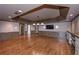 Basement with wood floors, recessed lighting, tv, and a stone shelf, offering plenty of space at 297 Collegiate Dr, Powder Springs, GA 30127