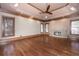 Spacious bedroom with hardwood floors, tray ceiling, fireplace and large windows at 297 Collegiate Dr, Powder Springs, GA 30127