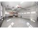Spacious garage with epoxy floors, offering ample parking and storage at 297 Collegiate Dr, Powder Springs, GA 30127