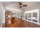 Open floorplan living room offering hardwood floors, backyard view, and lots of natural light at 297 Collegiate Dr, Powder Springs, GA 30127