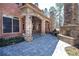 Inviting outdoor patio with a stone fireplace and arched openings, ideal for relaxation at 297 Collegiate Dr, Powder Springs, GA 30127