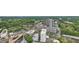 Aerial view showcases the area's buildings among surrounding trees at 3338 Peachtree Ne Rd # 1507, Atlanta, GA 30326