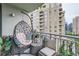Relaxing balcony featuring an egg chair and views of surrounding buildings at 3338 Peachtree Ne Rd # 1507, Atlanta, GA 30326