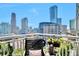 City skyline view from private balcony with seating, plants, and modern railings at 3338 Peachtree Ne Rd # 1507, Atlanta, GA 30326