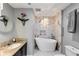 Bright bathroom featuring a soaking tub, marble accents, and modern fixtures at 3338 Peachtree Ne Rd # 1507, Atlanta, GA 30326