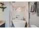 Bright bathroom featuring a freestanding tub with marble tile surround and a granite-topped vanity at 3338 Peachtree Ne Rd # 1507, Atlanta, GA 30326