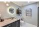 Well-lit bathroom features granite countertop, modern fixtures, and glass shower at 3338 Peachtree Ne Rd # 1507, Atlanta, GA 30326
