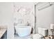 Modern bathroom with a freestanding tub, marble accent wall, and stylish fixtures at 3338 Peachtree Ne Rd # 1507, Atlanta, GA 30326